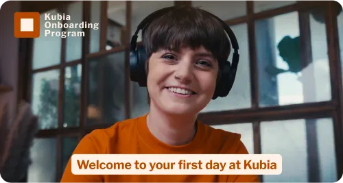 Smiling young woman wearing headphones with caption 'Welcome to your first day at Kubia'.